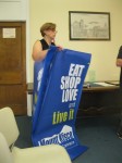 Mount Kisco Chamber of Commerce Executive Director Caroline Loeb revealed a banner last week that could be used to help promote the village. 