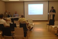 Senator George Latimer (at the podium) introduces the panel of financial experts during a financial literacy forum in Mamaroneck.