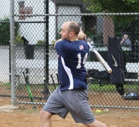 Zelem Pools third baseman Ryan Anderson displays his textbook follow-through swing as he slugs a homerun in the second inning against Beechmont Tavern. Photo by Albert Coqueran