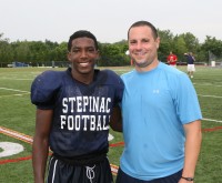 Junior Brandon Coleman (left) is being guided by (right) Crusaders Offensive Coordinator Joe Spagnolo. Coleman is expected to takeover at quarterback this season, after the graduation of Daniel Hoffer, who is presently playing for the University of Maine. Photo by Albert Coqueran 