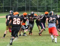 Tigers senior linebacker Daniel Bonner (center #20) breaks through the line during defensive football drills on Thursday, August 22, at White Plains High School. Photo by Albert Coqueran