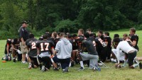 White Plains High School Head Football Coach Michael “Skip” Stevens speaks to his team at the end of practice, on Thursday, August 22. The Tigers are preparing to bounce back from a 1-7 disappointing season last year. Photo by Albert Coqueran