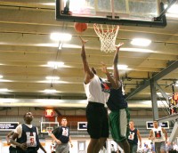 Nijee Lewis leaps to the hoop on a fast break and beats a Sacred Heart defenseman for two points, as the Tigers beat Sacred Heart 43-27, in the House of Sports Summer League. Lewis is a sophomore guard, who will be a welcome addition to the Tigers next season. Photo by Albert Coqueran