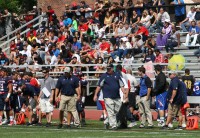 Stepinac Head Coach Mike O’Donnell (center) and his staff control the strategy from the sideline, as the Crusaders faithful enjoy their Home Opener win over Mount St. Michael, 47-14, on Saturday, September 7, at Stepinac High School. Photo by Albert Coqueran 