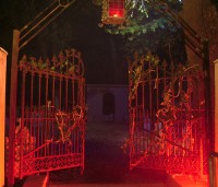 The entrance to Scared By The Sound is lit by an eerie red glow.