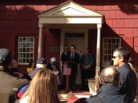 White Plains Historical Society President Robert Hoch reads the names of the soldiers who died during the Battle of White Plains. He is standing on the new porch at the Jacob Purdy House, General George Washington’s headquarters.