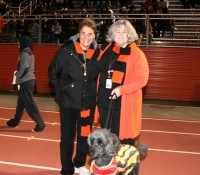 Sports-3 | The Examiner News WPHS Athletic Director Jennifer DeSena (left) and Principal Ellen Doherty (right) enjoy the Section 1 Quarterfinal game with the Principal’s dog Ros, on the sideline at White Plains High School. Photo by Albert Coqueran
