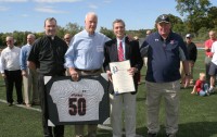 [L-r]- On Saturday, Oct.12, at Stepinac High School, famed Stepinac alumnus Bob Hyland had his jersey retired and City of White Plains Mayor Tom Roach presented him with a Proclamation. [L-r] Stepinac President Father Thomas Collins, Bob Hyland, Mayor Tom Roach and Crusaders Head Football Coach Mike O’Donnell celebrate the event. Photo by Albert Coqueran