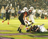 Tigers-2 | The Examiner News Tigers Matt Berube (left) singles touchdown as quarterback Cameron Crabbe (on ground) crosses the goal line on an eight-yard keeper to score the Tigers first touchdown of the game. Photo by Albert Coqueran