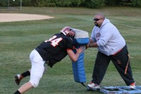 Tigers tight-end/defensive end Lukas Repetti pushes the sled with linemen coach Gabe Robles aboard at practice, on Thursday, Sept. 26. Head Coach Skip Stevens said of his senior tight-end. “Lukas is the only player on the team that made every morning practice in the summer at 6 a.m.” Photo by Albert Coqueran