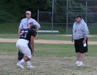 Tigers running back Chris Jordan is instructed by receivers coach Jim Avery (left) and Head Coach Skip Stevens (right) regarding pass routes at practice while preparing for the R.C. Ketchum game. Photo by Albert Coqueran