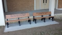 The two benches dedicated to William Eckfeld have been placed outside the White Plains High School Auditorium entrance.