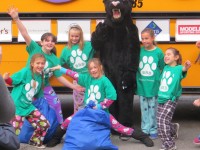 Bedford Road School students in Pleasantville, along with a friend, celebrate the efforts by their school and other children around the county that collected more than 5,000 pajamas for needy children. Jon Craig photo 