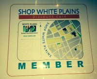 Businesses participating in the Shop White Plains Discount Card program will display this decal in their window.