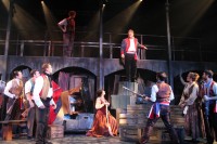 : Enjolras, played by Kyle Pressle, and Javert, played by Joseph C. Bellino, on the barricade during the opening night production of Les Misérables at White Plains Performing Arts Center. Kathleen Davisson Photos.