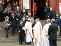 The Montgomery family leaves Our Lady of Loretta Church in Cold Spring last Friday after an emotional hour-long ceremony for Lovell.