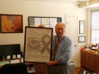 Thomas Manko holds a framed enlarged letter written by the mother of Sandy Hook victim—6-year-old Ana Marquez-Greene, which describes the bravery of teachers.