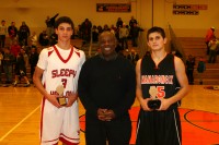 Mamaroneck High School beat Sleepy Hollow High School, 48-37, in the finale of the Harry Jefferson Showcase, at White Plains High School, on Sunday, Dec. 15. Tournament namesake Harry Jefferson (center) presented Horsemen guard Nick Arduino (left) with the Sportsmanship Award of the Game and Tigers Dean DeLucia (right) with the Most Valuable Player of the Game Award. 