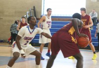 Crusaders guard Naim Thomas (left) guards Cardinals guard Patrick Moseh (right) in the first quarter of Stepinac versus Bishop Ireton game, at Stepinac H.S. on Sunday. Thomas played Moseh tough but the Cardinals star still managed 25 points and led Ireton to a 74-70 overtime win over Stepinac. Photo by Albert Coqueran