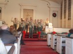 John Douville Jr., Devon Haywood and Michael McLynn, take the Pledge of the Eagle last Saturday during a ceremony that saw them reach scouting's highest rank.