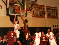 Back Page Sports Photo | The Examiner News Tigers’ guard Mike DeMello (left) spins and makes a backward layup for two points against Knights’ Judah Alexander in the third quarter of the White Plains versus Mt. Vernon game, on Wednesday, Jan. 8. Photo by Albert Coqueran