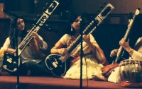 Maggie O’Keefe, Chander Ahuja, and Isra Ameen from the India Center play the sitar.