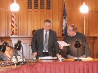 Carl Albano, with gavel in hand, sits as the chairman after he was finally elected by enough of the other legislators. County clerk Dennis Sant was running the meeting beforehand.