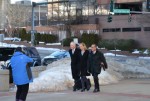 Kerry Kennedy flanked by her defense lawyers arrive at court for the start of her trial.