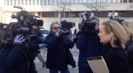 Kerry Kennedy is hounded by the media while leaving court after she testified Wednesday in her defense.