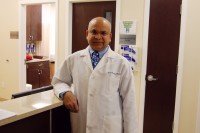 Dr. Sunil Gupta stands inside his small, but proud practice in Carmel. Gupta and one other doctor focus on keeping all the focus on the patients they see. 