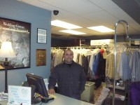 Photo caption: Artie Divila stands inside his Bryant Pond business, a proud owner since 2005. 