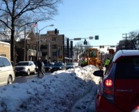 The White Plains Snow Loader runs parallel to traffic removing snow from Mamaroneck Avenue on Friday afternoon. 