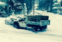 Snow removal from residential streets is made easier when cars are parked off-street. White Plains DPW truck at work. 