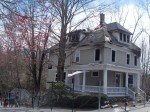 The century-old house at 91 Bedford Rd. the day after the fire that displaced Whispering Pines and seven residents.