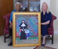 Pictured are Louis Bronz (left) with Mary Ann Berry flanking “Sister Celestine’s Beggar” at the presentation.