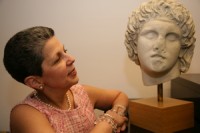 Water Music-2 | The Examiner News Georgette Gouveia with a bust of Alexander the Great. Photograph by Bob Rozycki. Courtesy of WAG magazine.