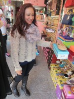 McKisses store manager Marisol Calderone shows some popular Anna footwear.