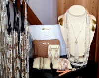 Hand-beaded jewelry and leather clutches compliment each other at Lola’s.