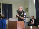 Westchester County Police Sgt. Jeffrey Weiss addresses Mount Kisco residents and the village board last week about the possibility of consolidating police operations with the county.