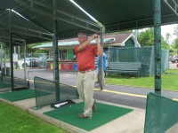 Yorktown resident Rocky Cambareri, a PGA member, teed off last week at the driving range at the Baldwin Golf Center in Baldwin Place. NEAL RENTZ PHOTO 