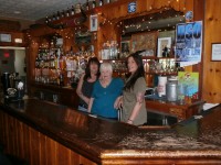 Photo caption: Joanie Mitchell (center), her daughter Janine (left) and one of their long time employees Brenda Heady all hope the Spruce Hill Inn can overcome tough times and stay open past July. Mitchell, a long time Putnam Valley resident, has owned the bar for 23 years.  DAVID PROPPER PHOTO 