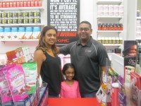June 17 NWE BOW GNC Pix | The Examiner News Photo caption: Ricky and Yasmin Jaisingh opened a GNC store in the Cortlandt Town Center in May. Also shown is their daughter, Malia. Photo credit: Neal Rentz