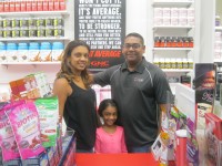 Photo caption: Ricky and Yasmin Jaisingh opened a GNC store in the Cortlandt Town Center in May. Also shown is their daughter, Malia. Photo credit: Neal Rentz 