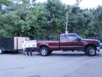 Robert De Lucia stands with one of pick-up trucks that’s ready to load up resident’s garbage and unwanted goods. The photo taken last Thursday was De Lucia’s first day putting all his energy into Local Boys after quitting his other job. DAVID PROPPER PHOTO 