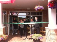 Bruce Sterman and his wife, Luda Pincus, owners of The Manhattan Chili Co., cut the ribbon at the grand opening last Friday of their new location on Marble Avenue as Pleasantville Mayor Peter Scherer and Chamber of Commerce Vice President Paul Alvarez look on. Janine Bowen photo 