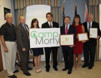 Camp Morty | The Examiner News (Left to right): Joseph A. Stout, executive director, Friends of Westchester County Parks; John Befus, deputy commissioner, Department of Social Services; Philippa Seltzer, youth service program coordinator, Department of Social Services; Michael Orth, second deputy commissioner, Department of Community Mental Health; County Executive Robert P. Astorino; Kathleen O’Connor, commissioner, Department of Parks; Ed Buroughs, commissioner, Department of Planning.