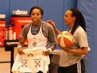 NY Liberty current star Cappie Pondexter gets a few words of encouragement and a pat on the back from Liberty legend Teresa Weatherspoon, during practice at the Madison Square Garden Training Center, in Tarrytown, on Thursday, June 26. Albert Coqueran Photos