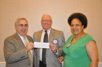 Left to right: Steve Holden, Trustee of the RCWP Foundation Norm Szymanski, immediate past president and Heather Miller, current president. 