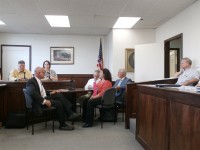 OLYMPUS DIGITAL CAMERA | The Examiner News Putnam Valley Supervisor Bob Tendy (black suit, near left) and county health commissioner Dr. Allen Beals (blue suit, far right) argued over the closing of Spur Beach at a July Health Committee meeting with legislators looking on.