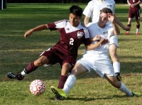 Harrison's Rene Marin (2) looks to keep ball away from defender.